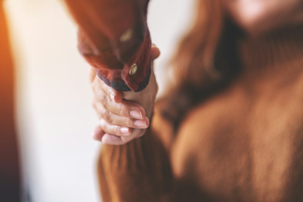 Closeup image of two people shaking hands